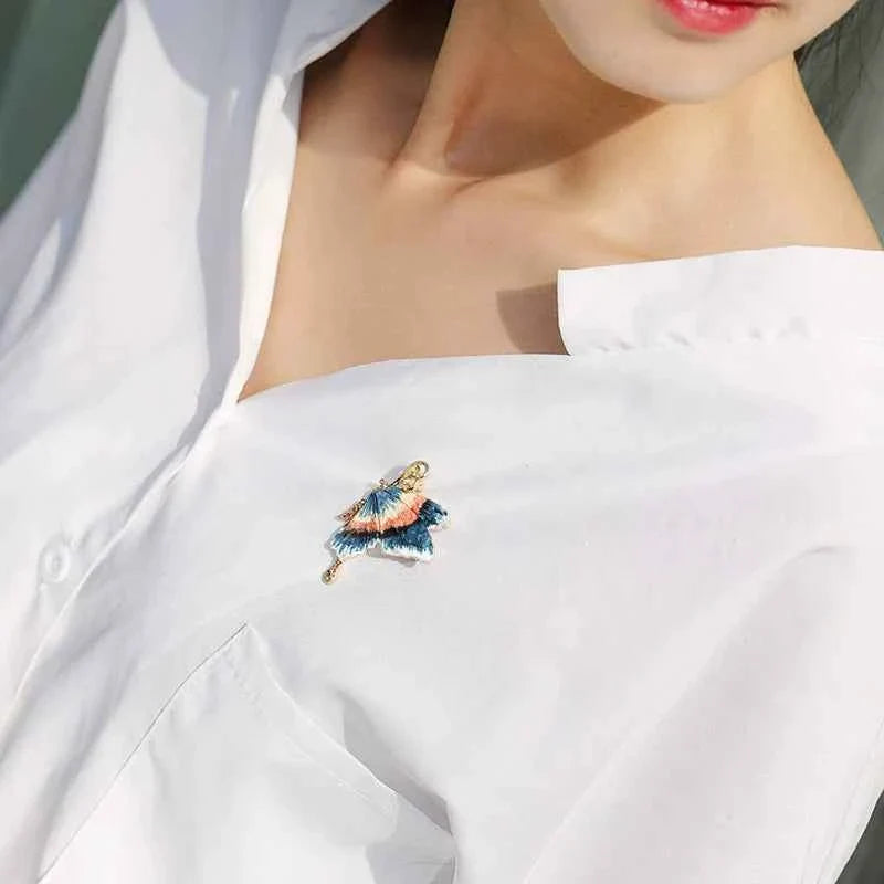 Butterfly enamel pin with rhinestones, blue-and-peach wings and gold fastening