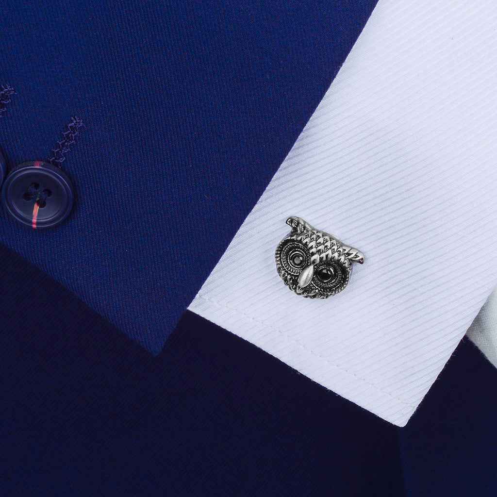 Owl-shaped antique silver cufflinks on dress shirt cuff