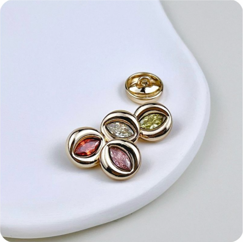 Gold evil eye metal buttons set with clear, yellow, pink and red zircon stones