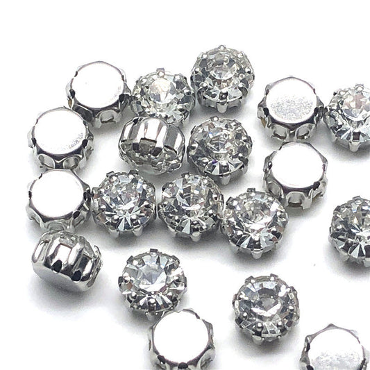 Set of clear round rhinestone buttons with 8-claw flat back prongs and silver edges