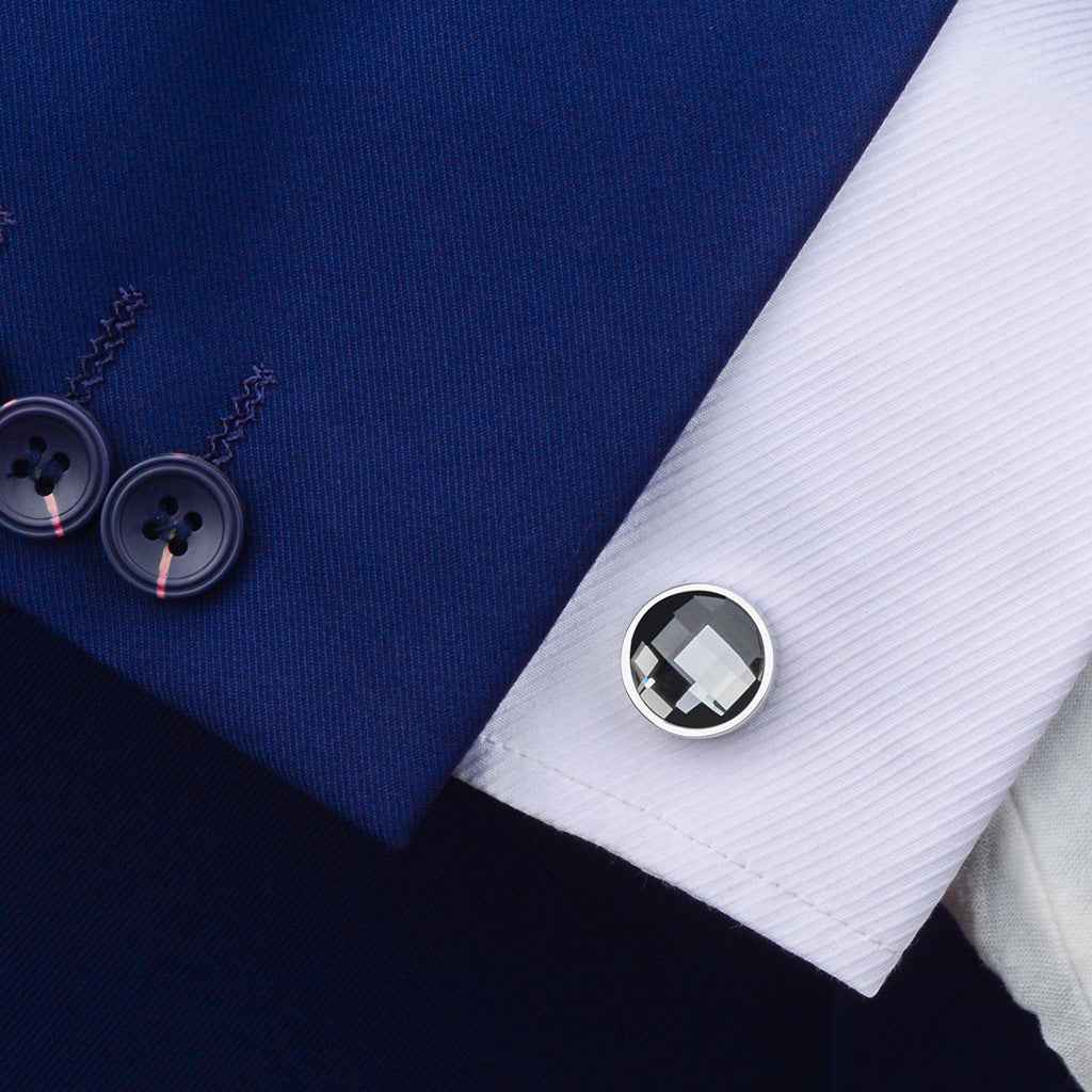 Faceted round crystal cufflink set on a dress shirt cuff