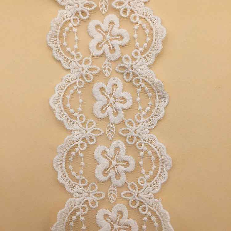 White mesh embroidered lace with four-petal floral motifs and scalloped border; Style #1