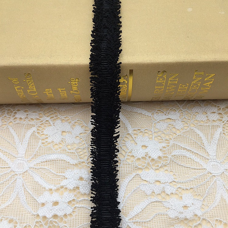 1.5cm metallic fringe trim, black base with gold and silver threads, 20 yards