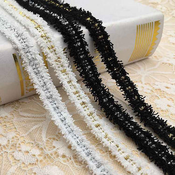 1.5cm metallic fringe trim, white base with gold threads and black edging accents