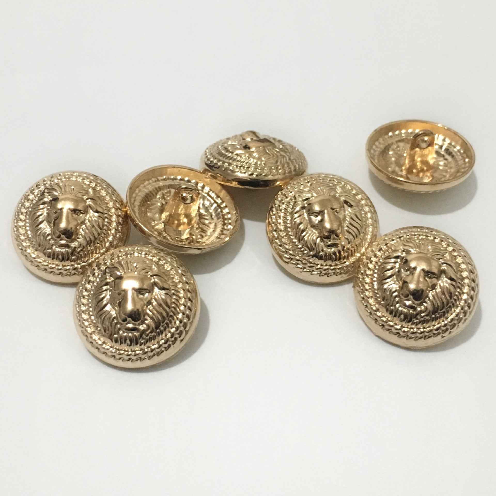 Gold lion head metal shank buttons, round fronts with ornate ring and back view