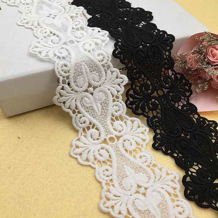 Black and white embroidered lace trim with floral scalloped motifs, water-soluble