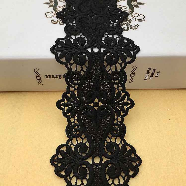 Black floral embroidered lace trim with scrolling motifs and scalloped edges