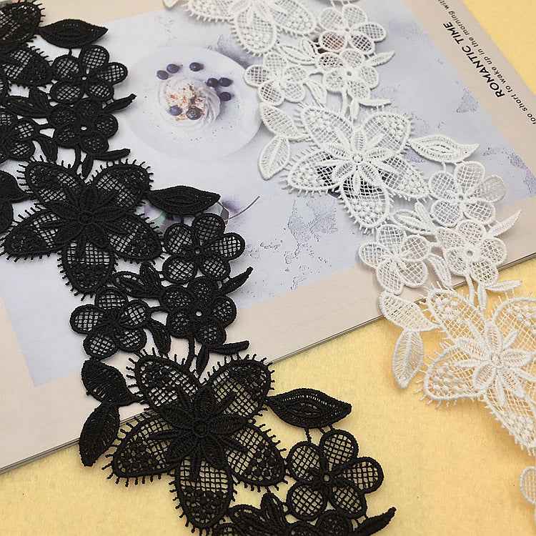 Black embroidered lace trim, 9.5 cm wide, dense floral motifs with layered leaf shapes
