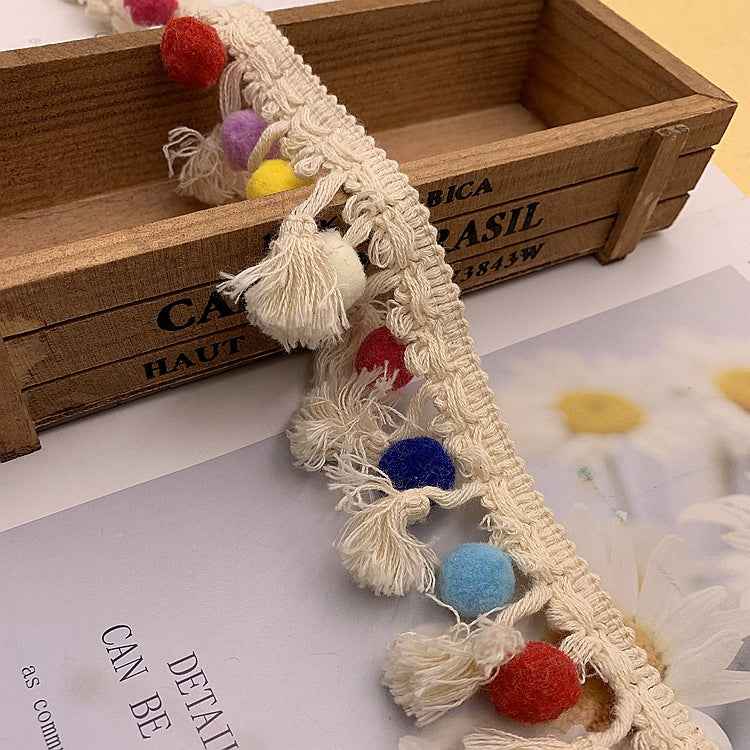 Ivory cotton lace trim with multicolor pom-pom fringe and hanging tassels