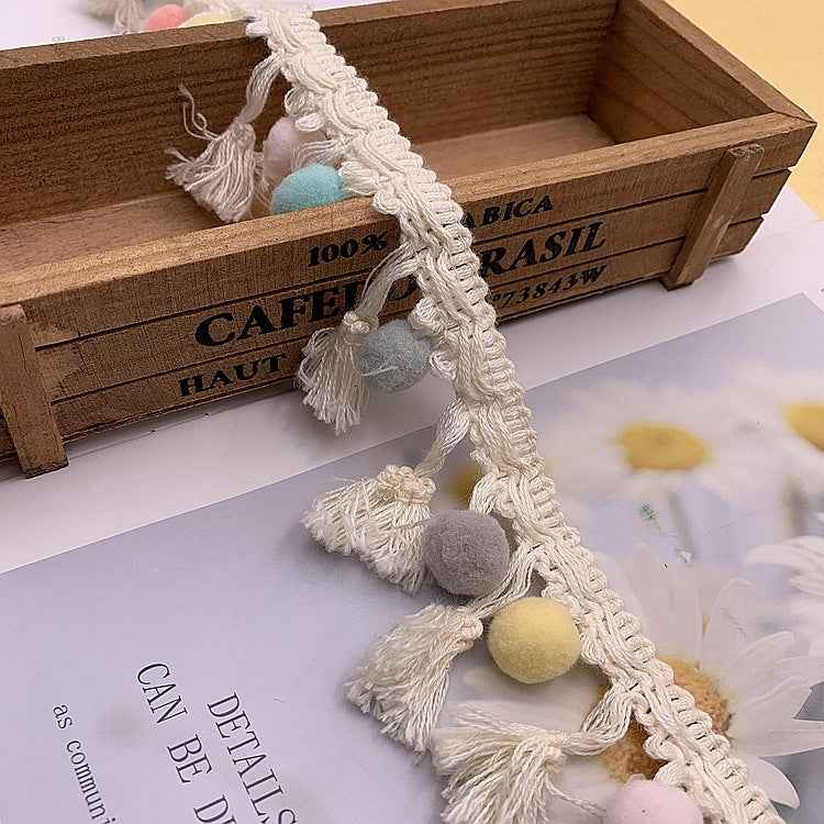Cream cotton lace trim with light-blue and multicolor pom-pom tassels