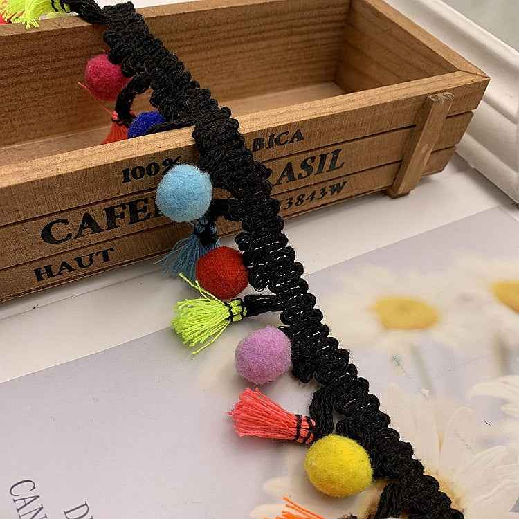 Black cotton lace trim with multicolor pom-pom fringe and hanging tassels