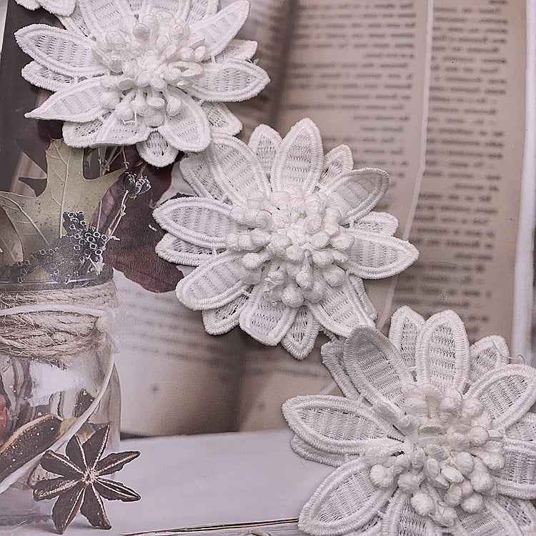White 3D floral lace trim with large layered petals and raised bead-like center