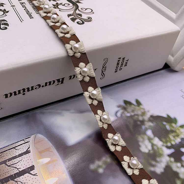 1.5 cm ethnic jacquard lace trim in brown with pearl-like flower accents and tassel trim