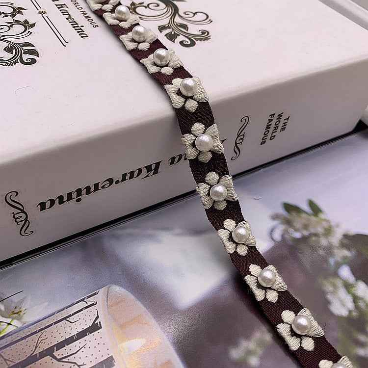 Dark purple jacquard lace trim, 1.5 cm wide, with pearl flower motifs and bead details