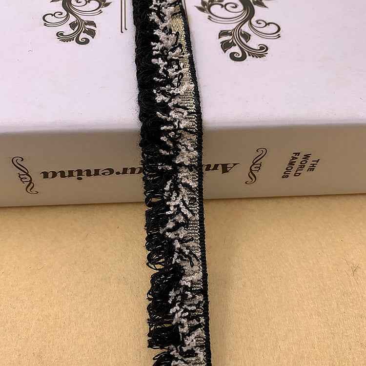 Black lace fringe trim with silver-toned pattern and loop detail