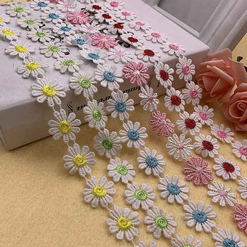 Daisy-petal lace trim, white with multicolor floral daisies along a scalloped edge