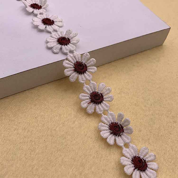 Daisy-petal lace trim, white with dark red/burgundy daisy centers along the length