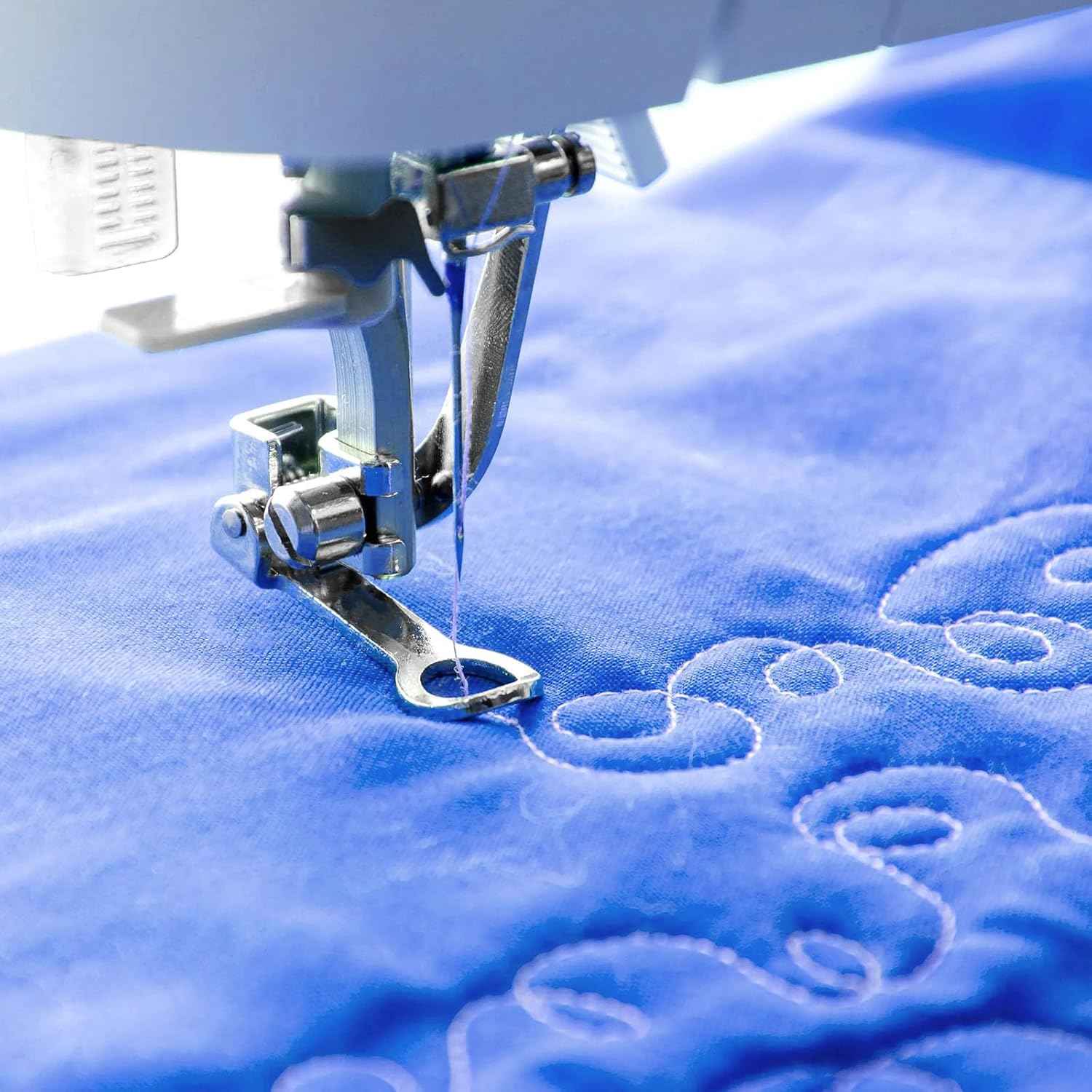 Presser foot stitching on blue fabric, freehand darning/stippling low-shank attachment