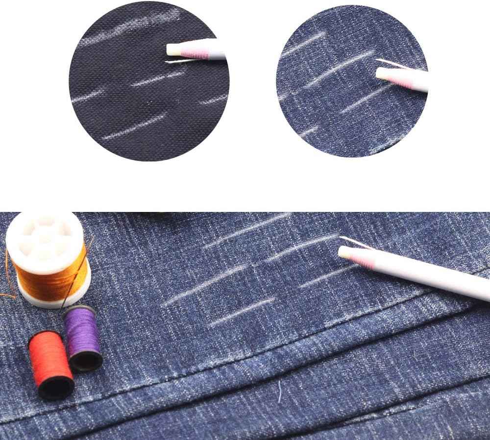 Sewing marking pencil drawing light lines on dark denim fabric