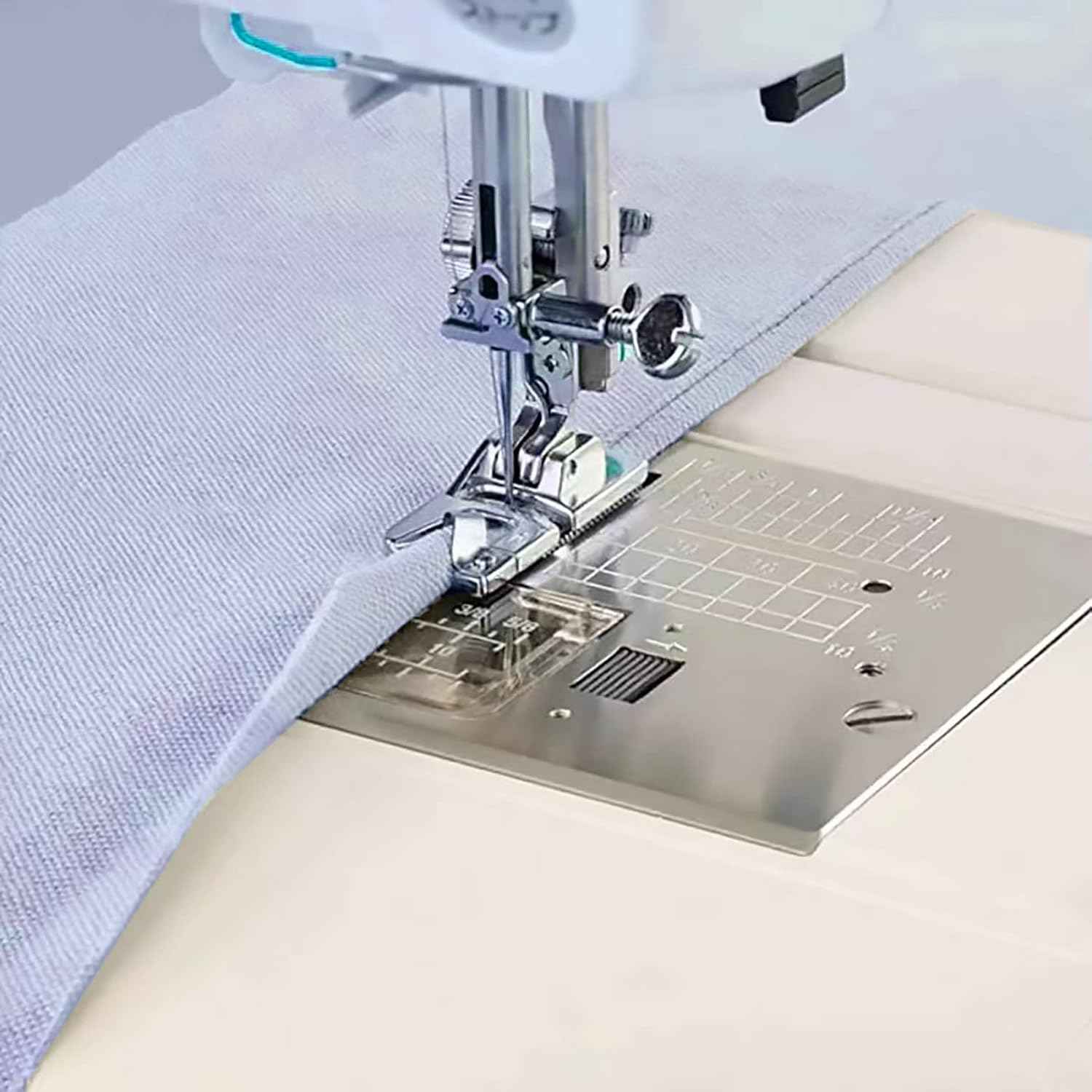 Sewing machine with narrow rolled hem foot guiding folded fabric edge for a rolled hem