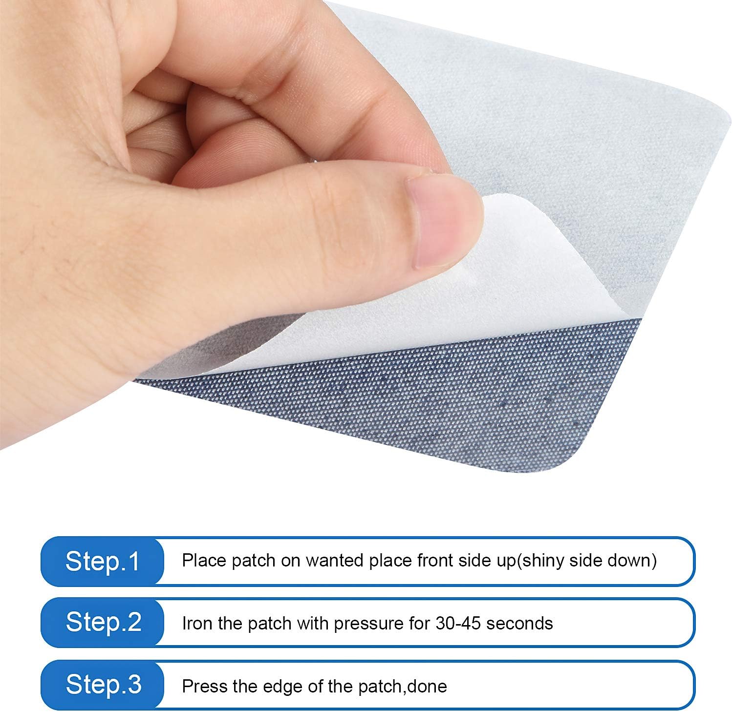 Hand presses an iron-on denim patch onto fabric; apply with heat on patch edges