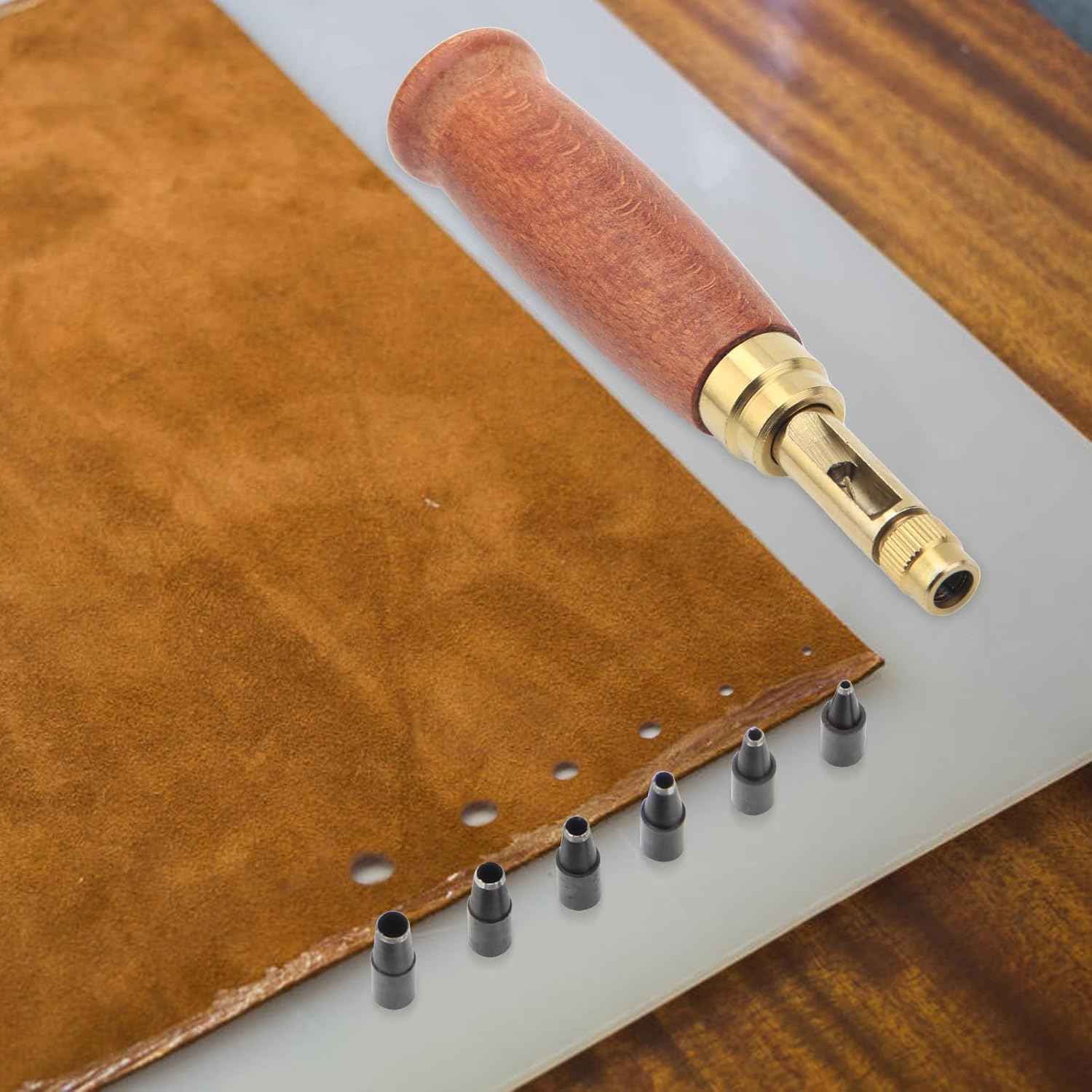 Leather strip with punched holes and wood-handled hole punch tool with tips