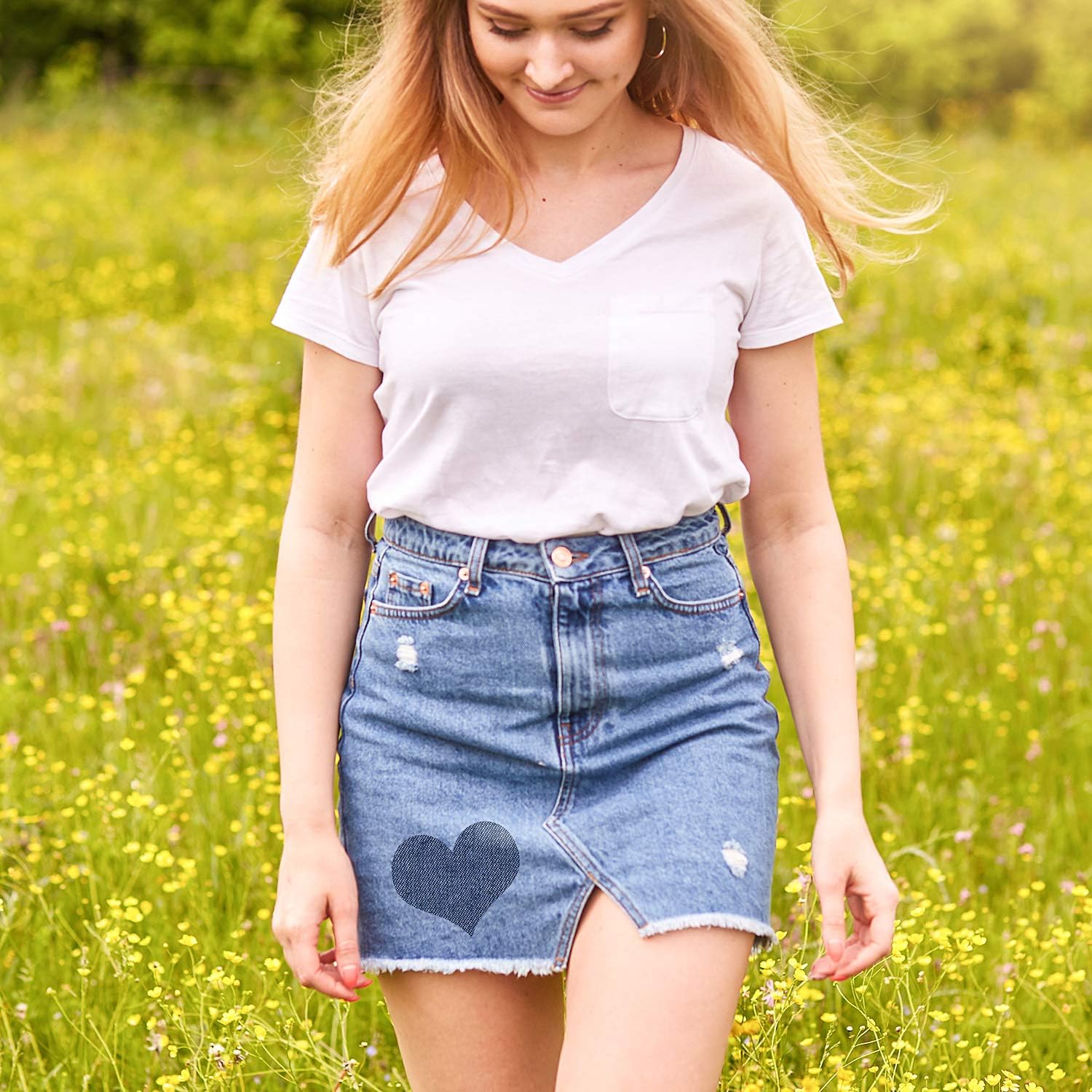 Denim skirt with a stitched-look heart iron-on patch on the front