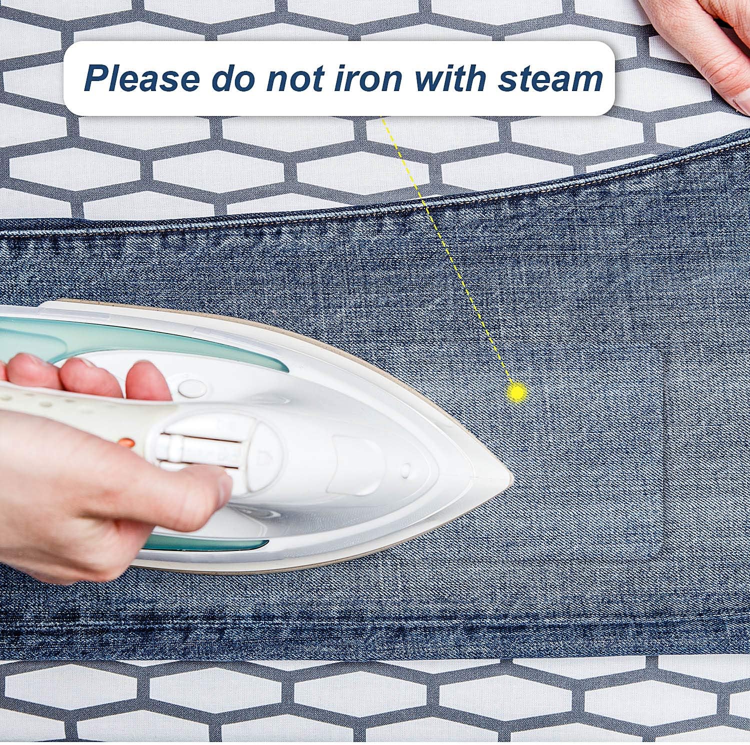 Iron-on denim patch being pressed onto jeans; avoid steam while ironing