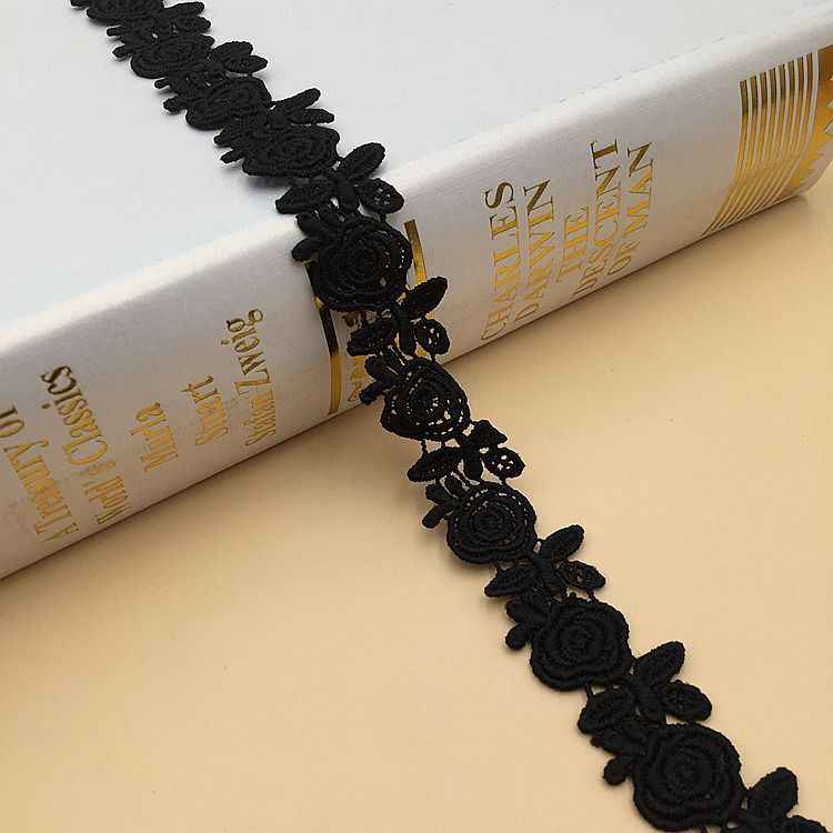 Black lace trim with floral rosette embroidery and scalloped edge, 1.5–2.5 cm wide
