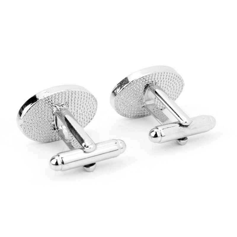 Silver-tone cufflinks with textured oval fronts and visible bar clutch backs