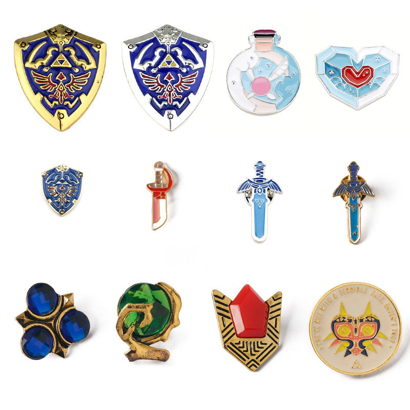 Schild-Anstecknadel-Set mit mehreren Designs: blau-goldenes und silbernes Schild-Emblem