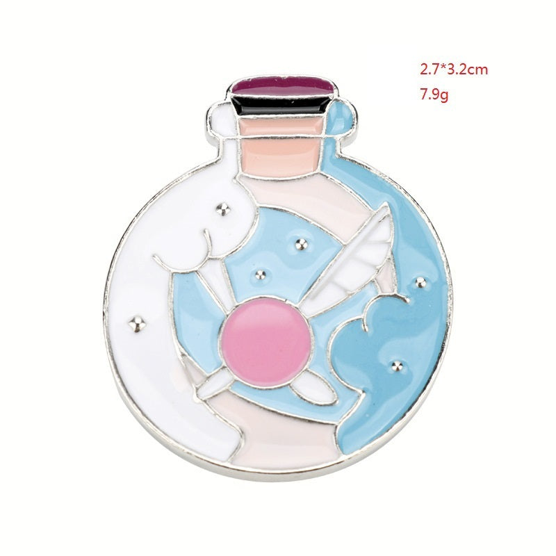 Round shield enamel pin brooch with blue, pink, and white emblem