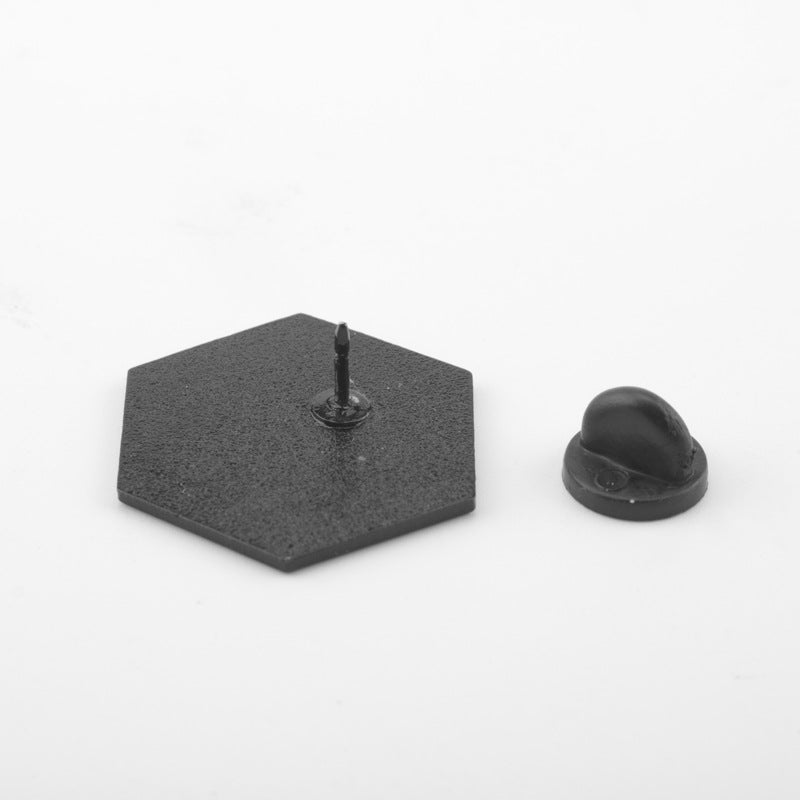 Enamel metal pin back with hex-shaped base and black butterfly clasp.