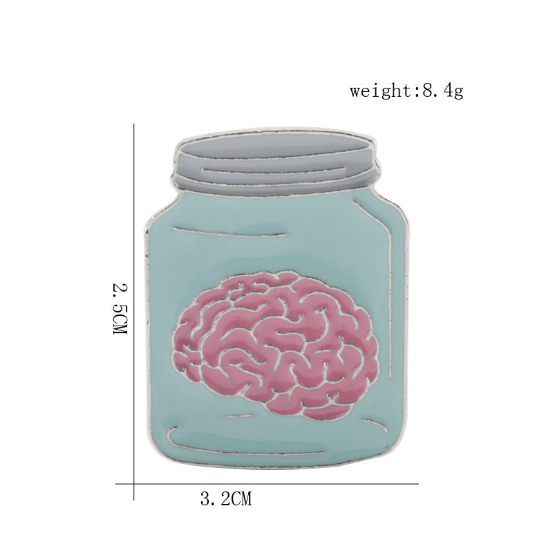 Light teal brain in jar enamel brooch pin with pink brain graphic