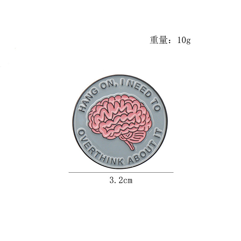 Round enamel brain brooch pin, 'Hang on I need to' text ring