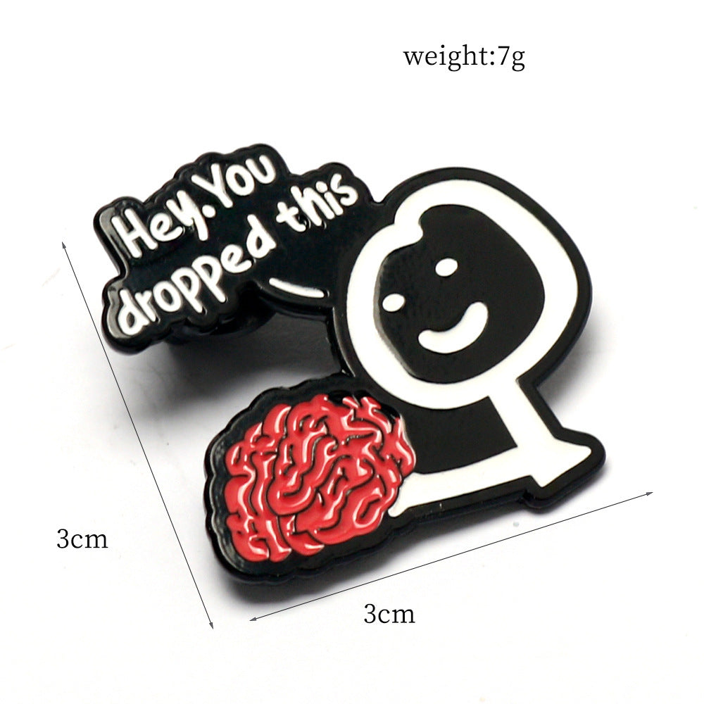 Black speech-bubble 'Hey, You dropped this' brain enamel brooch pin