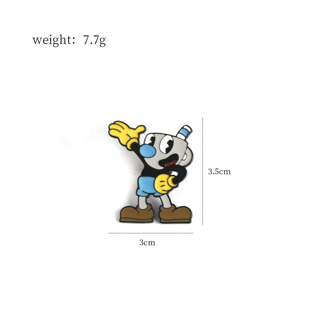 Einzelne Metall-Anstecknadel mit Mugman-Motiv, blaues Outfit, erhobene Faust