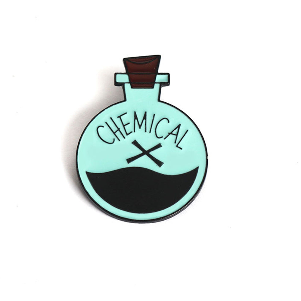 Chemical X enamel brooch pin, round teal and black graphic with clasp back