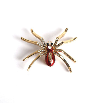 Gold-tone glitter spider brooch with red teardrop body and clear rhinestone legs
