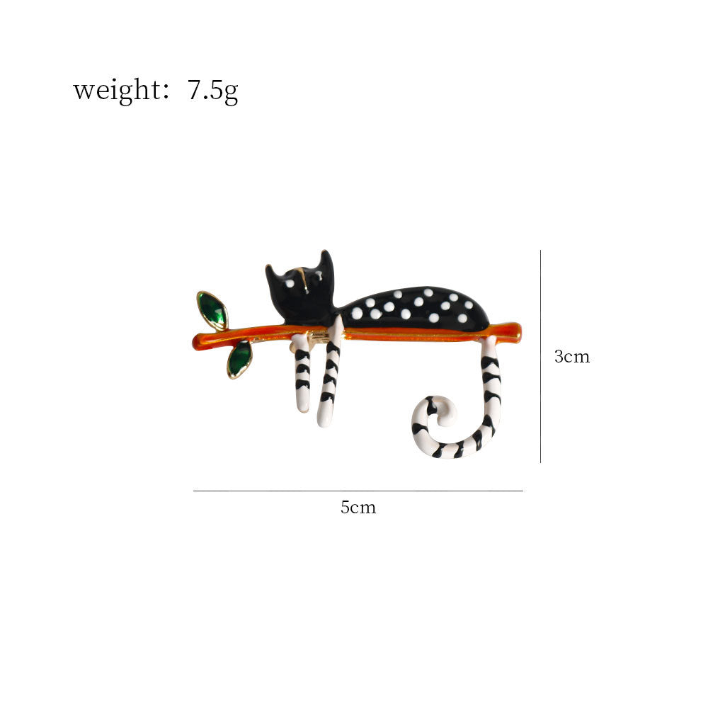 Black spotted kitty cat brooch with striped legs and curled tail, 5cm long