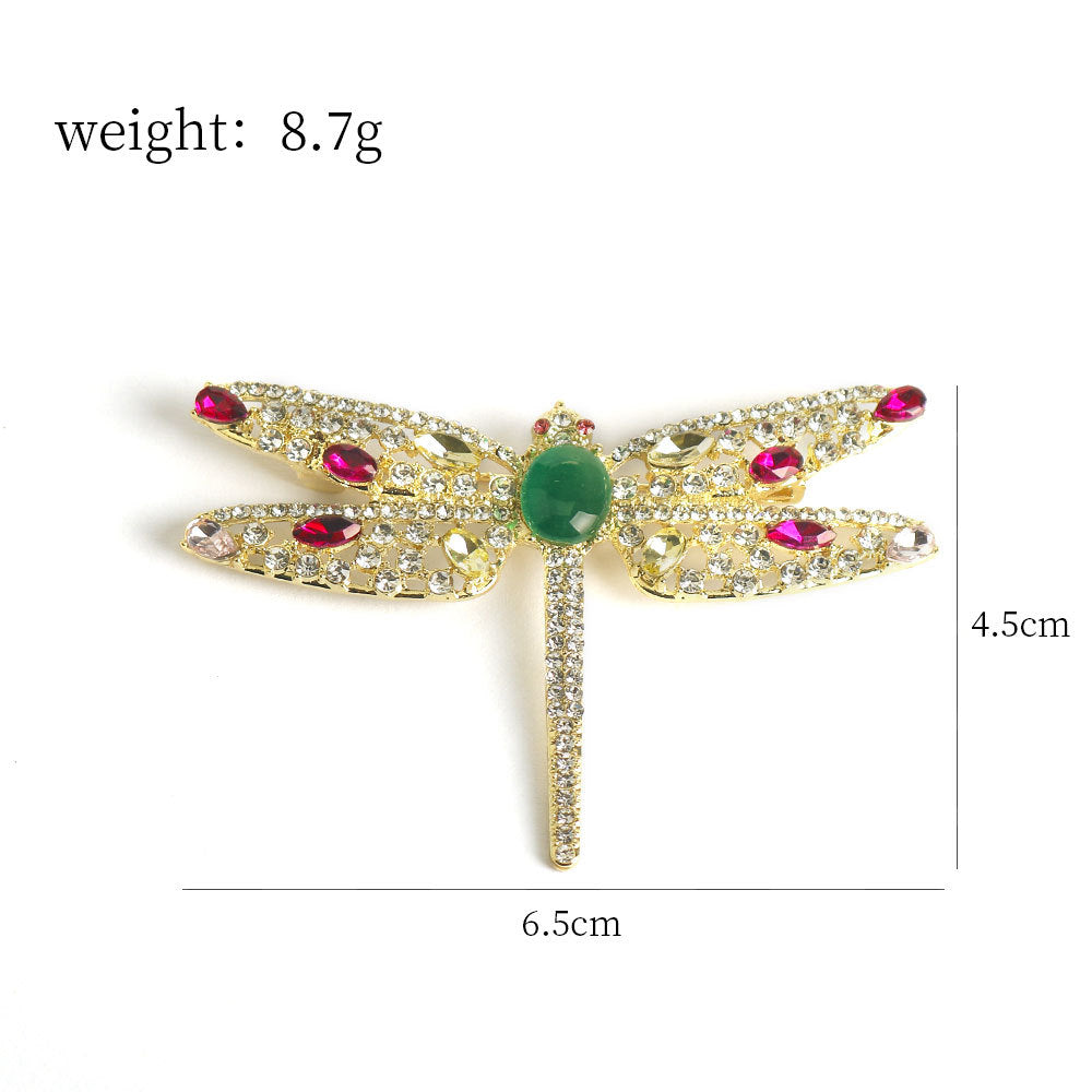 Dragonfly brooch pin, 6.5 cm long, green center with pink crystal stones