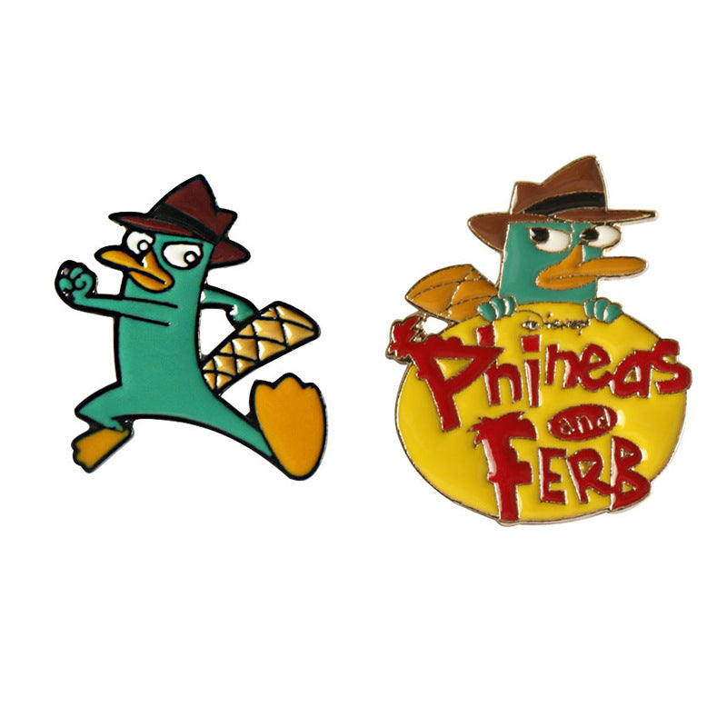 Zwei Metall-Anstecknadeln: Platypus im Hut (türkis) und Platypus im Hut (gelb)