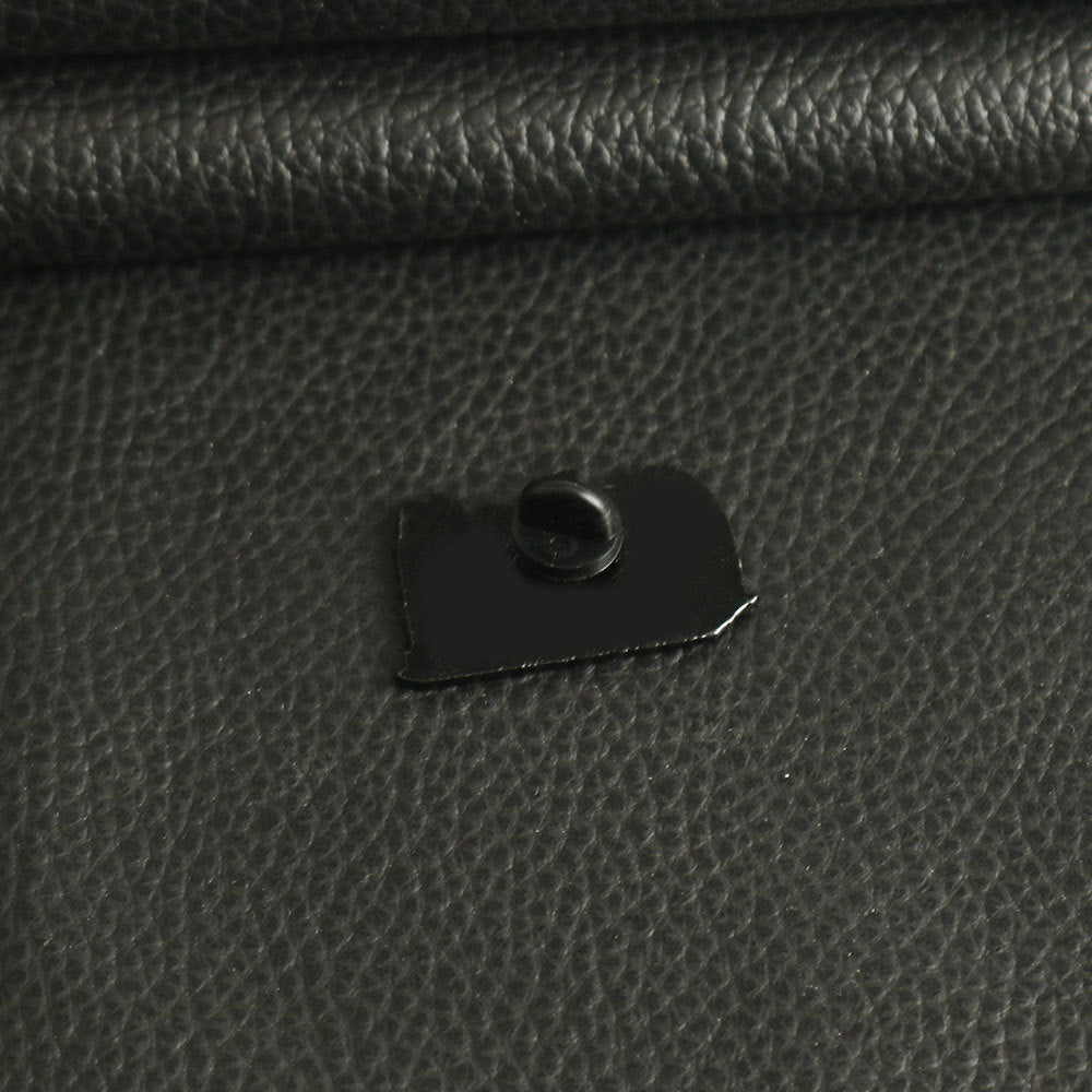 Metal brooch pin back with locking clasp and pin on dark backing