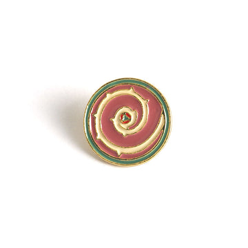 Steven Universe shield brooch pin, circular enamel design with maroon center and gold edges