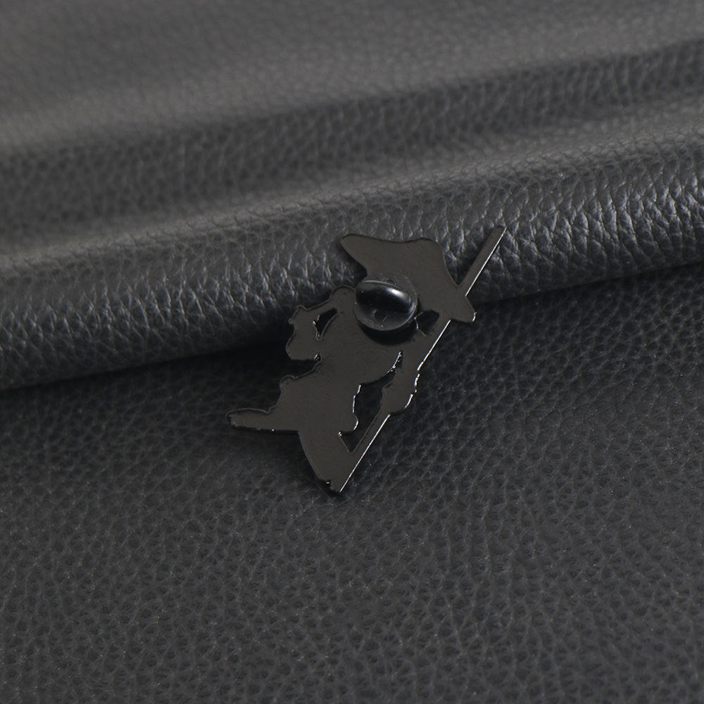 Metal pin back on gray fabric, secure clasp for lapel brooch