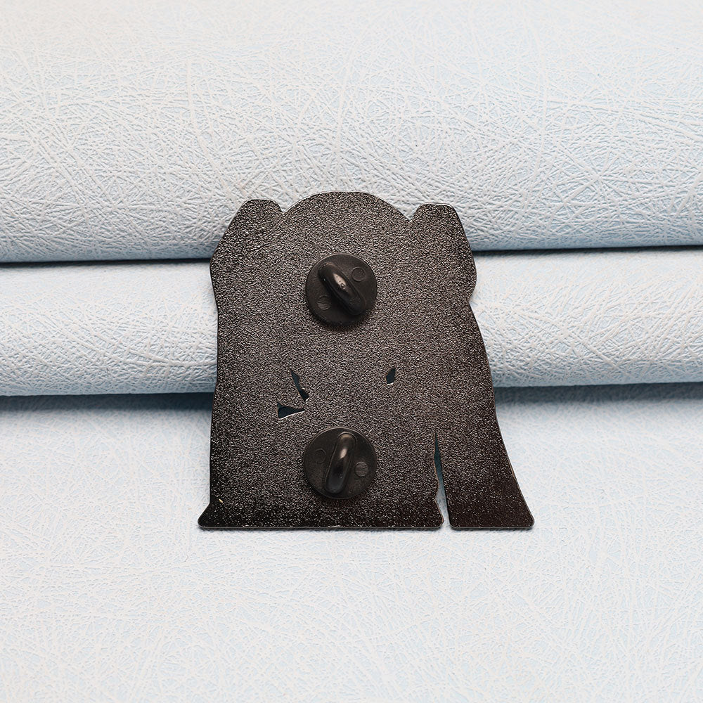 Back of Hatsune Miku pin badge with two black posts and metal clasp