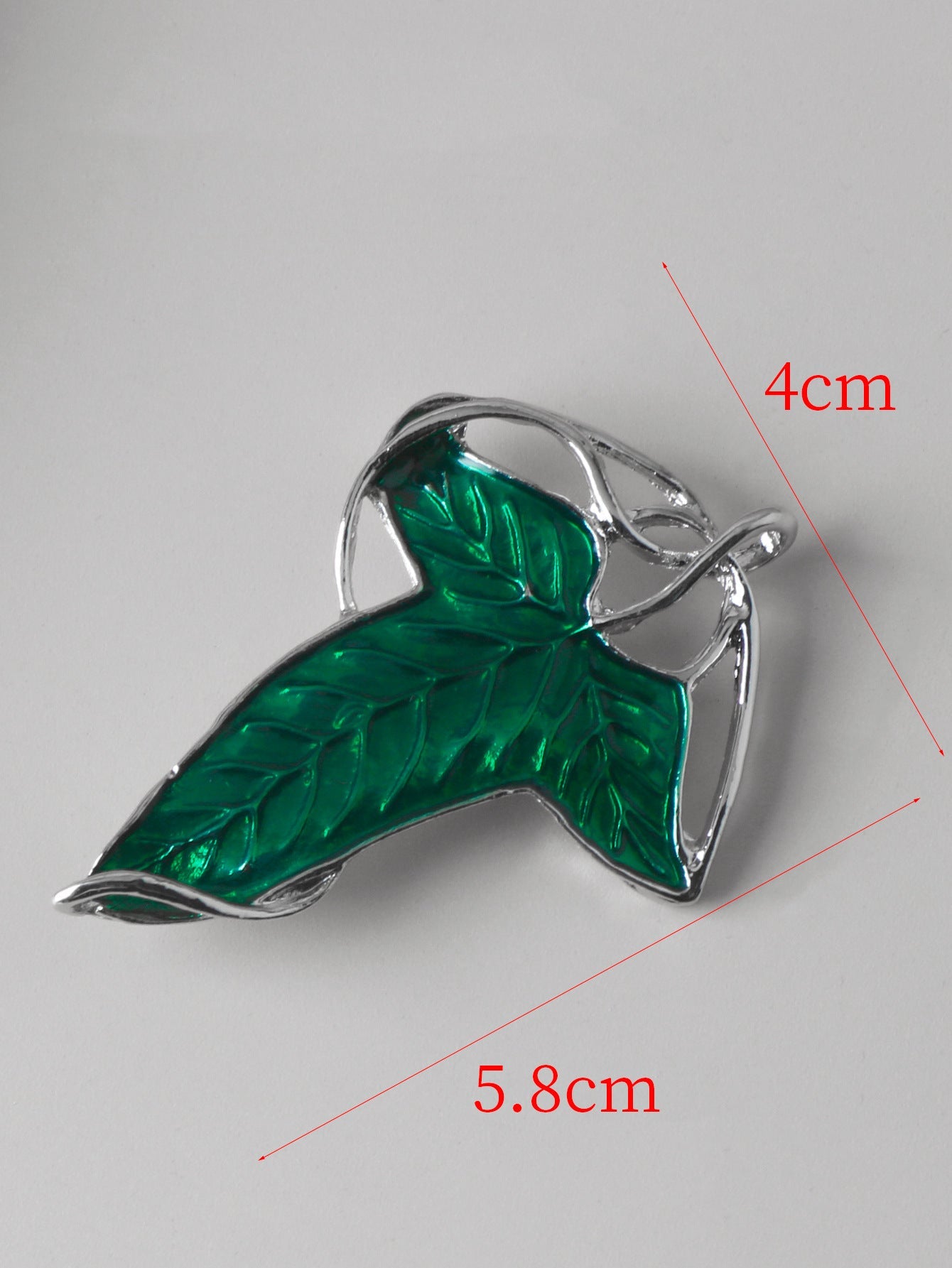 Elven leaf brooch pin with dark green enamel leaf and silver-tone metal frame