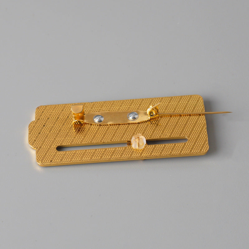 Gold-tone pin backing with metal safety clasp for MY SOCIAL BATTERY mood slider