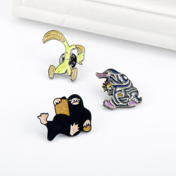 Niffler metal brooch pin set (3) colorful character pins: yellow, blue, black
