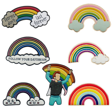 Metal rainbow bridge brooch with “storms don’t last” and “last forever” cloud text